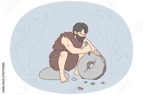 Ancient man with beard who lives in cave uses stone tool to create wheel. Neanderthal man in cloak made of animal skin invents primitive devices for grinding grain. Flat vector illustration
