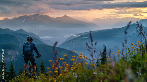 A mountain biker paused at a scenic overlook contemplating the vista.