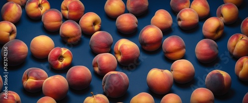 Fresh peach fruits on dark blue. Top view flat lay photo