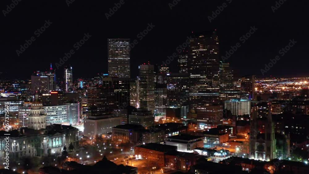 Aerial Forward Shot Of Illuminated Skyscrapers In Modern City Against Clear Sky At Night - Denver, Colorado Aerial Forward Shot Of Illuminated Skyscrapers In Modern City Against Clear Sky At Night - Denver, Colorado