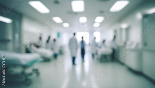 Teamwork in Healthcare: Blurred Figures of Medical Professionals in Hospital Hall - Symbolizing Collaboration and Innovation in Patient Care - Unfocused Background © Nastassia