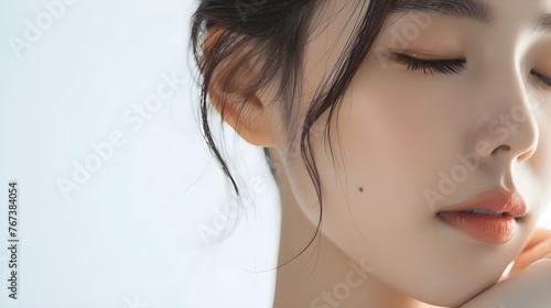 Natural beauty young asian woman has a smiling face with closed eyes. Cosmetology, beauty and spa concept.