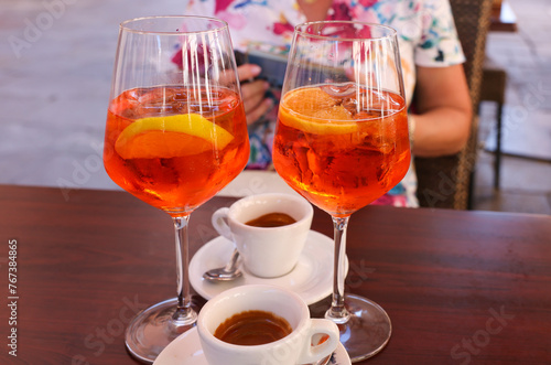 Two espressos and two Aperol Spritz - time to relax in Venice. Italy. photo