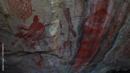 Prehistoric primitive cave art. Red painting of lizard on wall in Brazil