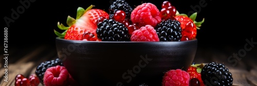 Colorful banner with ripe strawberries, blackberries, and raspberries © firax