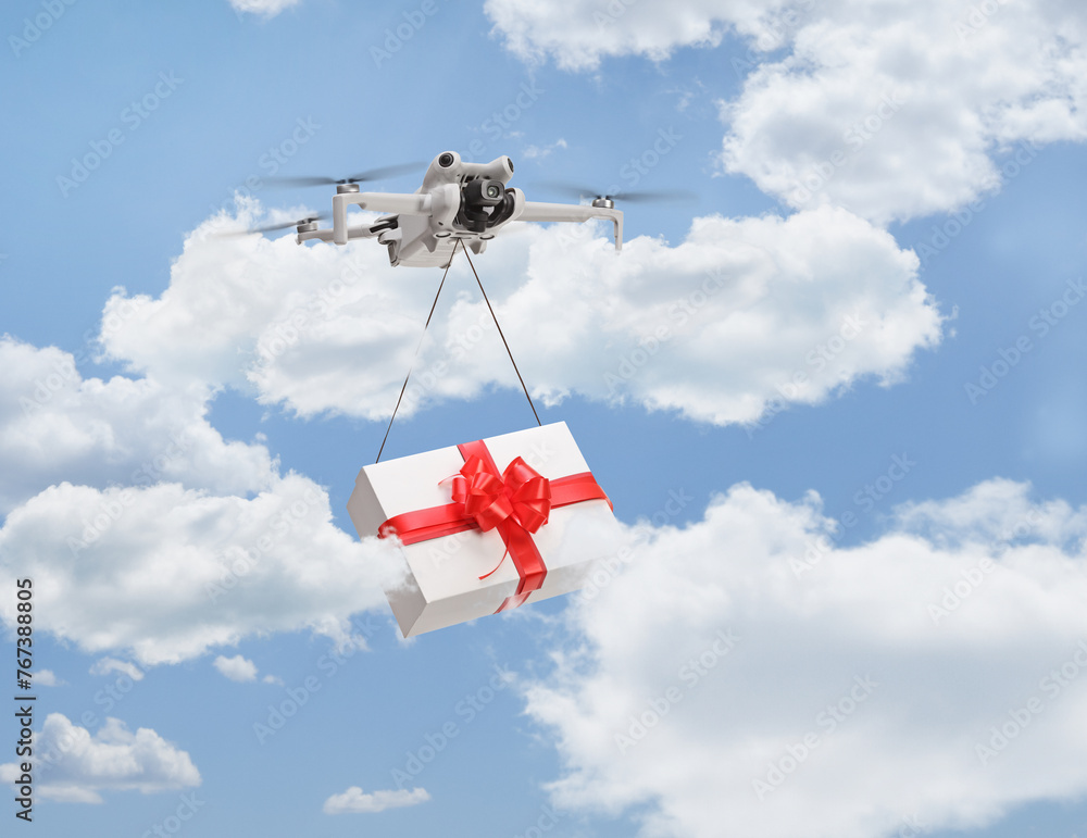 Obraz premium Drone delivering a gift box and flying