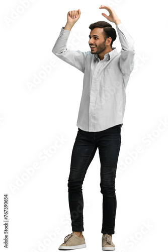 a man on a green background rejoices. raised his hands up