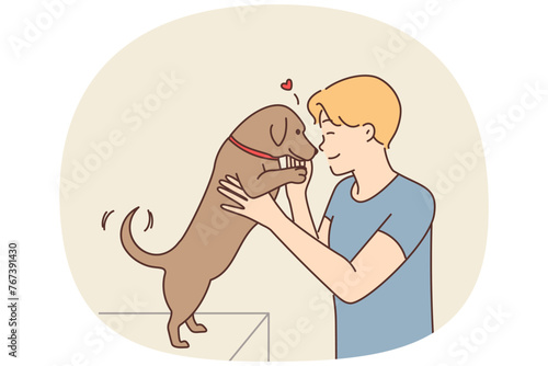 Happy man playing with dog