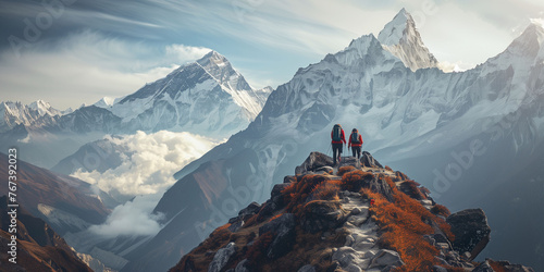Trekkers Overlooking Majestic Snow-Capped Mountain Range photo