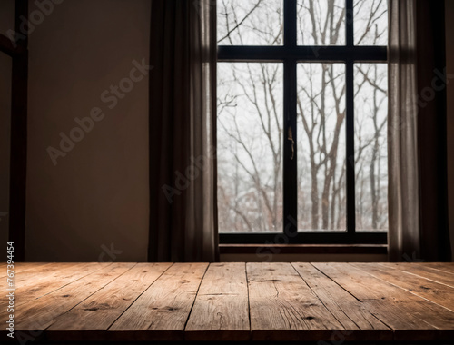Close-up of the surface of an empty wooden table near the window