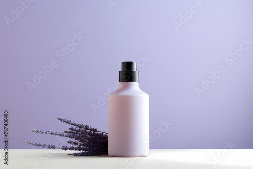 A minimalist skincare product bottle in a soothing lavender color, arranged neatly with copyspace on a blank label for customization.