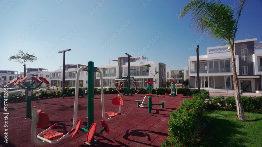 Image showcasing Luxury residential complex playground, upscale outdoor gym surrounded ...