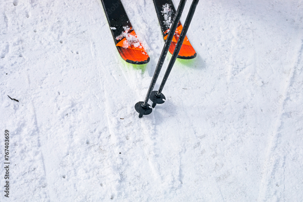 skis and poles on the ski slope. start of the ski season