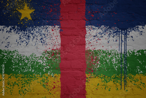colorful painted big national flag of central african republic on a massive brick wall