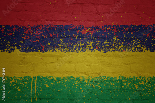 colorful painted big national flag of mauritius on a massive brick wall