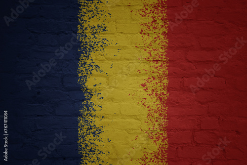 colorful painted big national flag of chad on a massive brick wall
