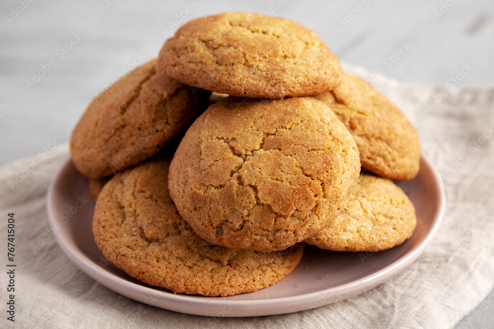 Homemade Soft And Chewy Snickerdoodle Cookies on a Plate, side view. Homemade Soft And Chewy Snickerdoodle Cookies on a Plate, side view.