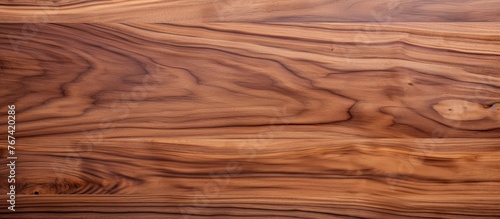 An image showing a detailed view of a table made of wood, showcasing its smooth wooden surface