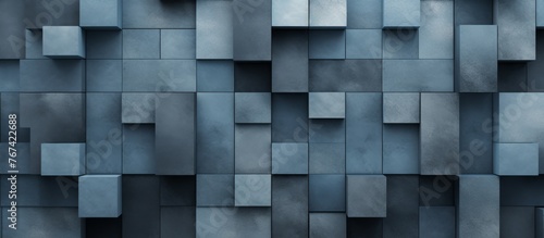 The brick wall is made up of rectangular grey and azure bricks, giving it a unique appearance. It is a composite material with wood flooring in front of it, creating a modern look