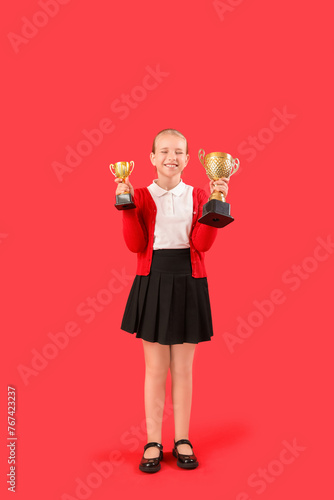 Cute little schoolgirl with...