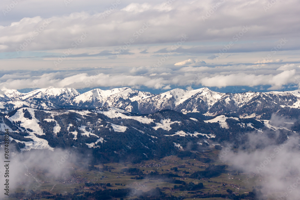 Mountain landscape in the Alps - white clouds between the peaks Mountain landscape in the Alps - white clouds between the peaks