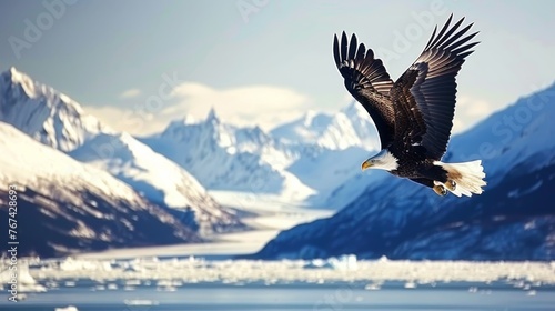  a bald eagle flying over a body of water with mountains and icebergs in the background in the foreground.