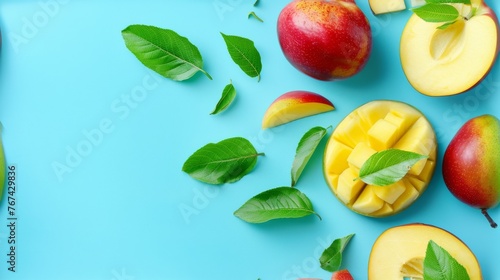  apples, mangoes, and leaves on a blue background with a green leaf on the top of the image.