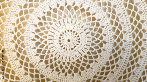 Exquisite handmade crochet lacework detail with intricate vintage pattern and artistic handiwork in white cotton photo
