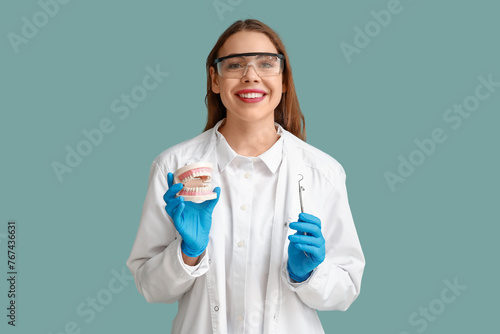 Female dentist with dental ...