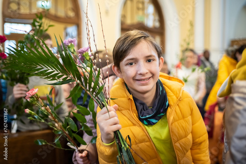 Photography An 11-year-old boy in church on Palm Sunday.