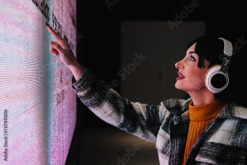 Wheelchair User Interacting with Touchscreen Art Exhibit