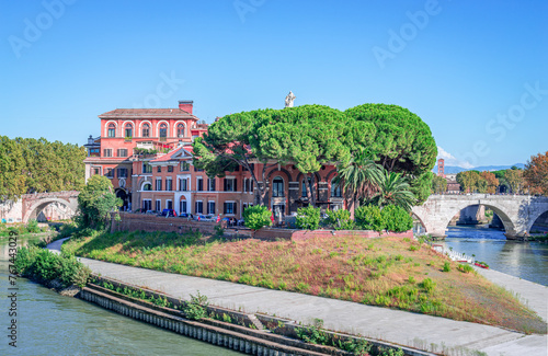 Εκτύπωση καμβά Tiber Island in Rome, Italy with the Fatebenefratelli Hospital and Ponte Cestio on the right, an ancient Roman stone bridge