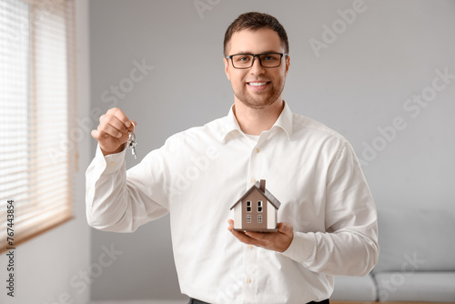 Male real estate agent with...