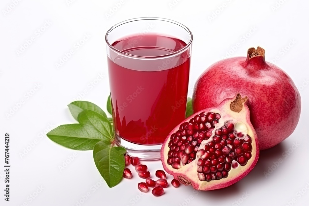Pomegranate juice with fresh Pomegranates on white background Pomegranate juice with fresh Pomegranates on white background