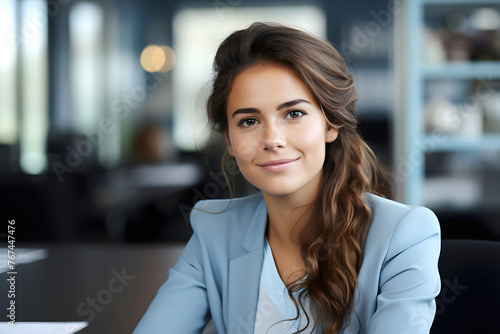 portrait of a beautiful young business woman in an office room. success in business and study