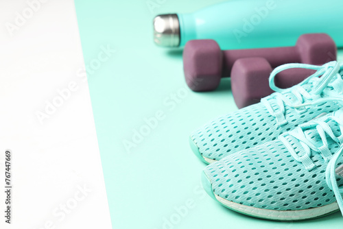 Sportive shoes, dumbbells a...