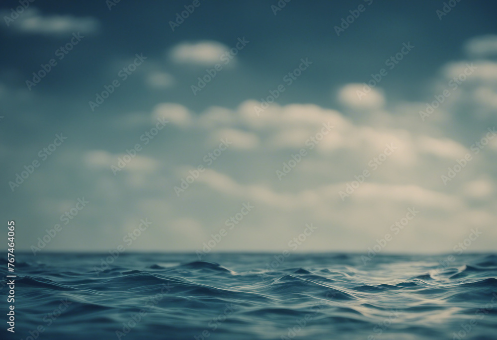 Obraz premium Immerse in Coastal Beauty: Deep Blue Sea Texture with a Sunny Sky and Fluffy Clouds, Inviting You to Relax and Enjoy Nature's Majesty