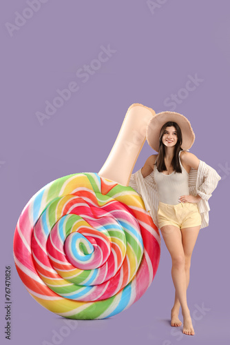 Smiling young woman in summ...