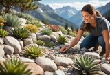 A woman tends to succulents in an alpine rock garden, mountains soaring in the background.
