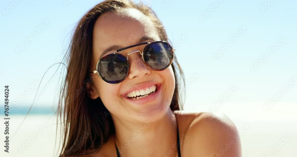 Woman, sunglasses and relaxing at beach for wellness, smiling and vacation on sea or relaxing on holiday. Female person, confident and happy in portrait or cool eyewear, nature and travel in outdoors Woman, sunglasses and relaxing at beach for wellness, smiling and vacation on sea or relaxing on holiday. Female person, confident and happy in portrait or cool eyewear, nature and travel in outdoors