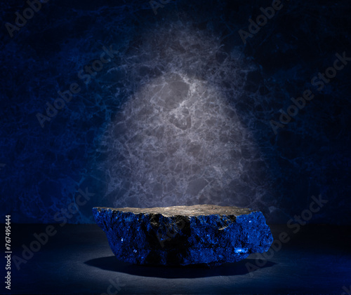 podium with stones with texture on a dark background