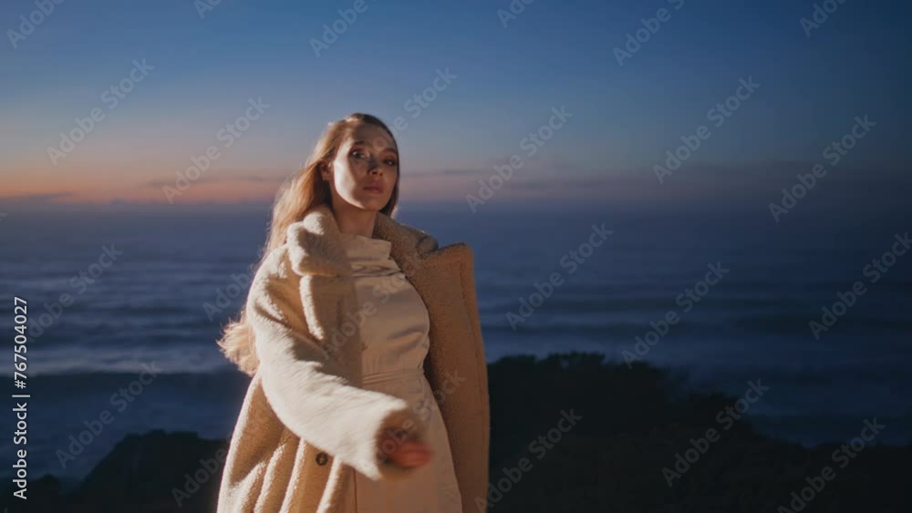 Relaxed dancer waving hair performing ocean beach evening. Party woman dancing Relaxed dancer waving hair performing ocean beach evening. Party woman dancing
