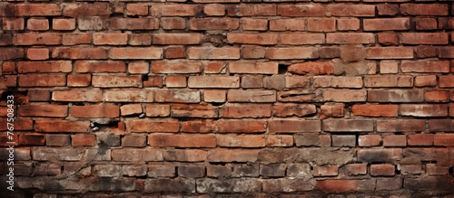Detailed close up of a weathered old red brick wall showcasing the craftsmanship of brickwork and mortar, creating a stunning facade with rectangular shapes