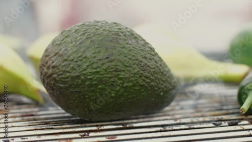Grilled Banana on fire, latin american vegan grill with avocado and pepper, thai or Ecuadorian Street food. African traditional food on grill. 