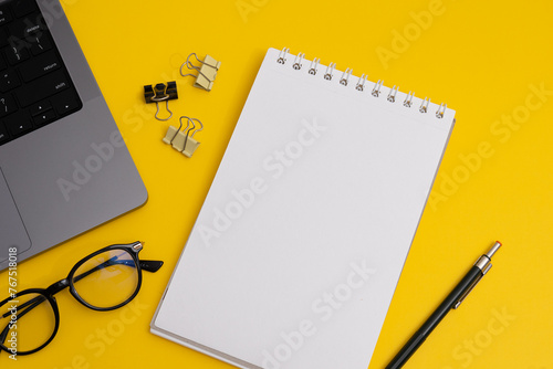 Yearly Planning, Notebook and Pencil with Business Supplies on Yellow Background (ID: 767518018)