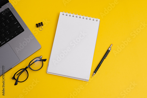 Yearly Planning, Notebook and Pencil with Business Supplies on Yellow Background (ID: 767518019)