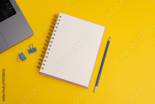 Notebook with wish list to-do list on yellow background, flat lay style. Planning concept. (ID: 767518030)
