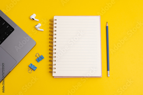 Study mood and notebook with wish list to do list on yellow background, flat lay style. Planning concept. (ID: 767518049)