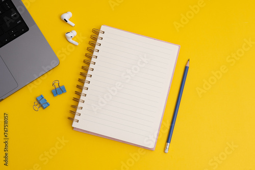 White Notebook and black glasses with wish list to-do list on yellow background, flat lay style. Planning concept. (ID: 767518057)