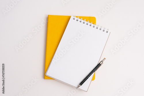 Flat lay, yellow notebook wish list with pencil on white background (ID: 767518059)
